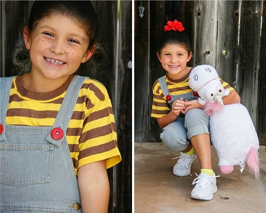 a girl wearing overalls with red buttons like Agnes from Despicable Me