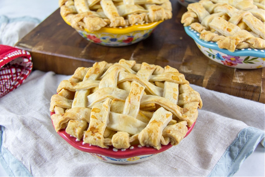 mini apple pies baked in Pioneer Woman 5" pie dishes