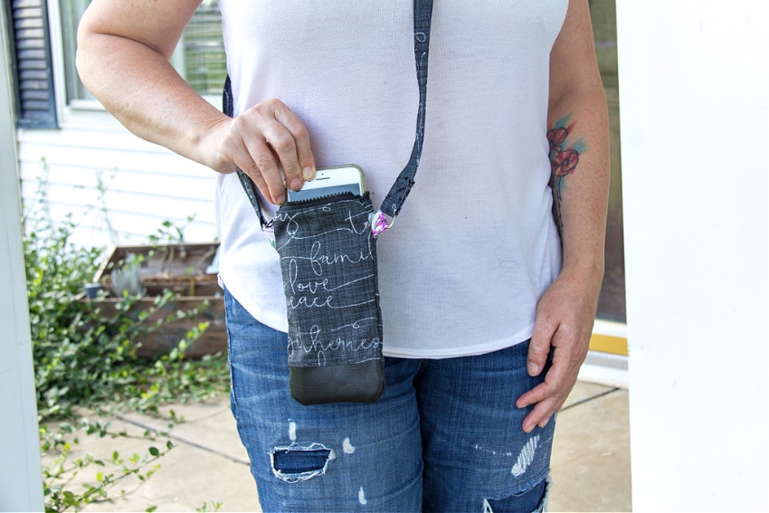 girl holding a handmade cross-body phone purse