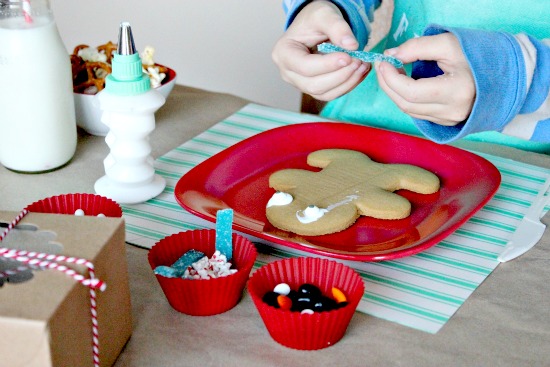 a child decorating holiday cookies