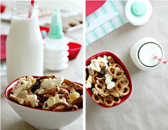 trail mix and milk set up for kids to enjoy while decorating cookies