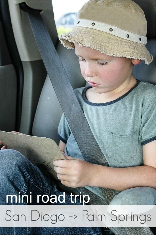 boy in a car on a road trip