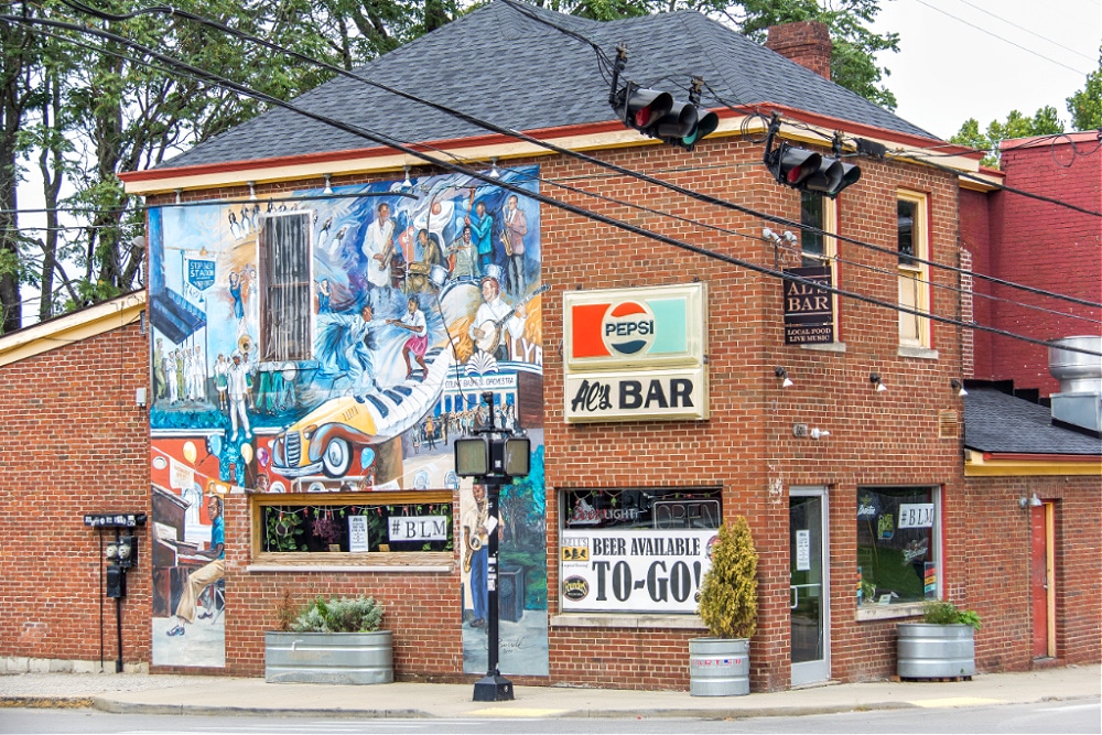 A tradition of music mural by Michael Burrell on the wall of Al's Bar in Lexington