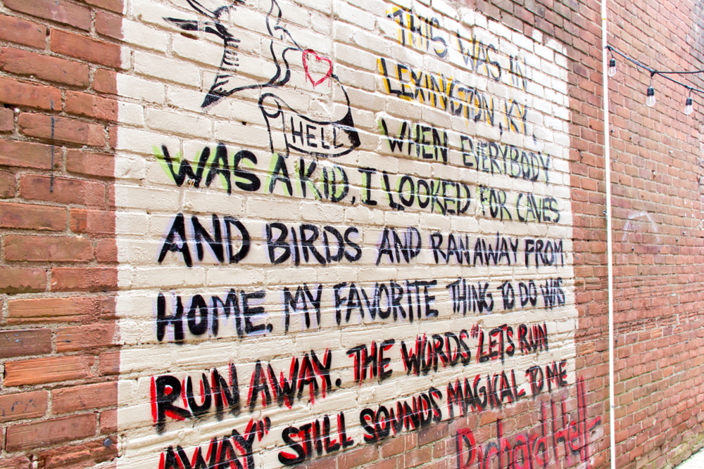 word mural inside an alley off north limestone in lexington