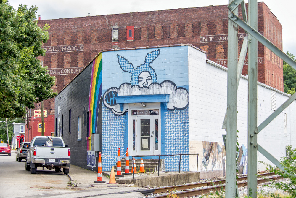 The Head in the Clouds mural by Left Handed Wave on the corner of Bryan Avenue and North Limestone in Lexington.