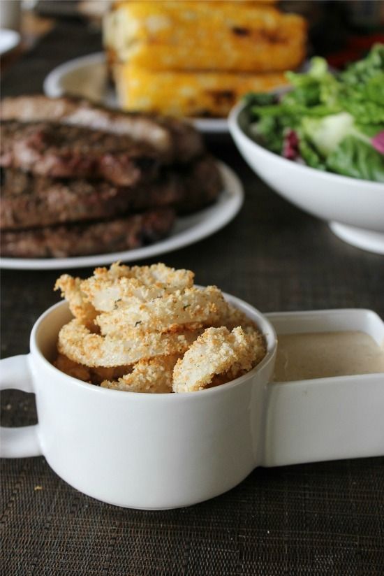 baked onion rings with steak, corn, and salad