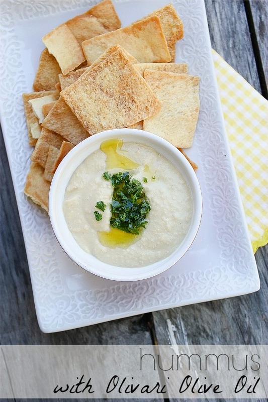 homemade hummus in a bowl with pita chips