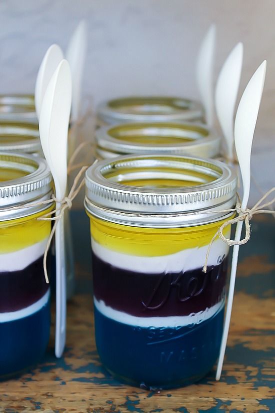 Blue, yellow, and purple jelly layered in canning jars for a Despicable Me Minion party.