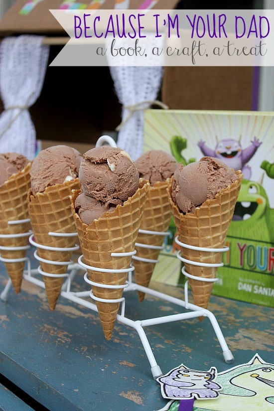 Rocky road ice cream cones in a cone holder with a Because I'm Your Dad book for Father's Day.