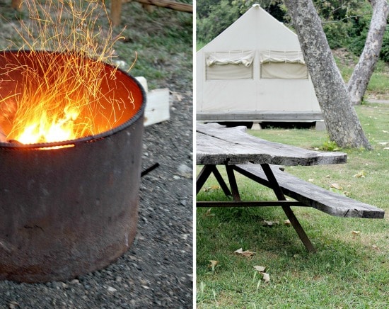 A fire pit and picnic bench outside the glamping tent at El Capitan Canyon in Goleta California.