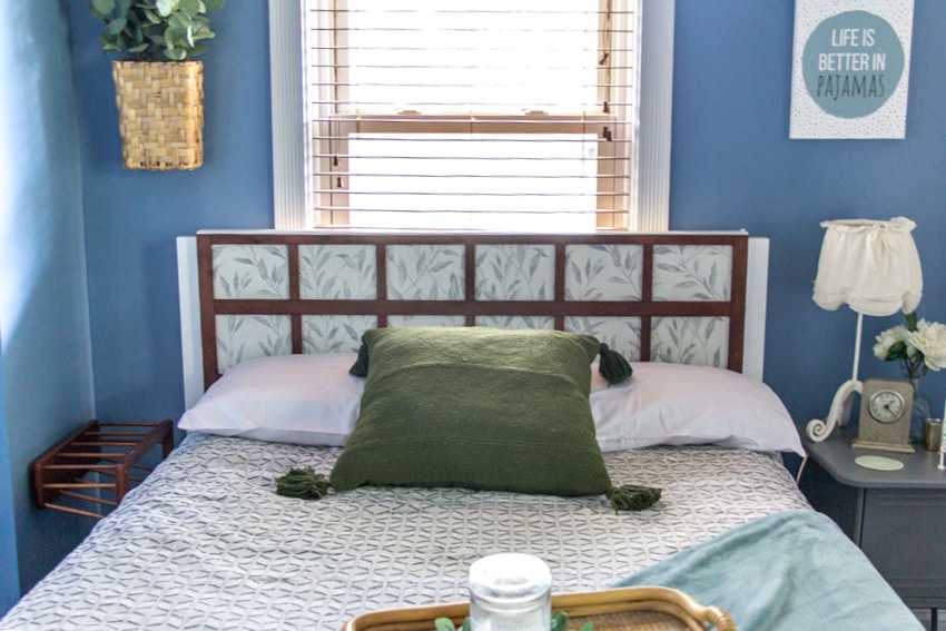 a diy wood headboard made for a guest bedroom to block a draft from the window