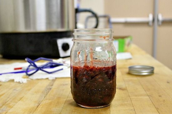 Homemade strawberry jam in a canning jar.
