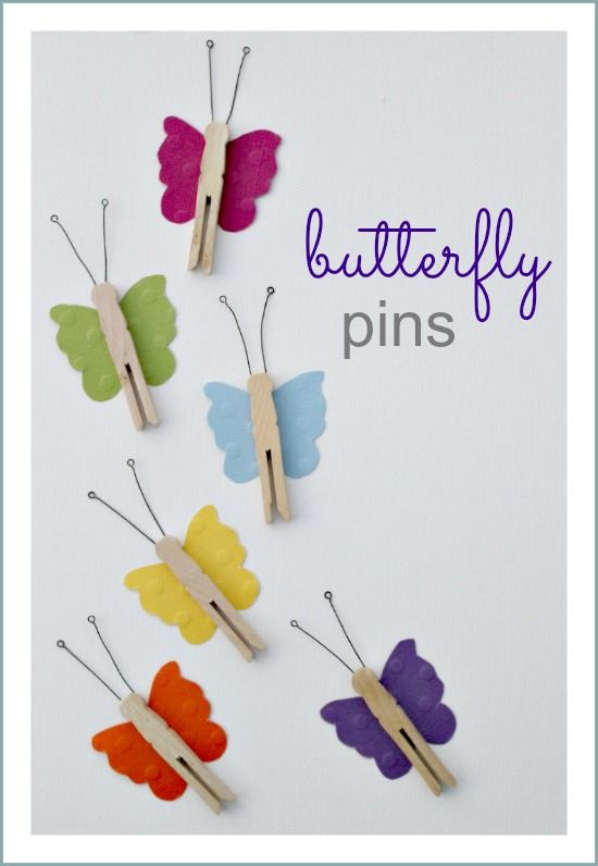 Handmade butterfly clothespins made using scrapbook paper and wood pegs.