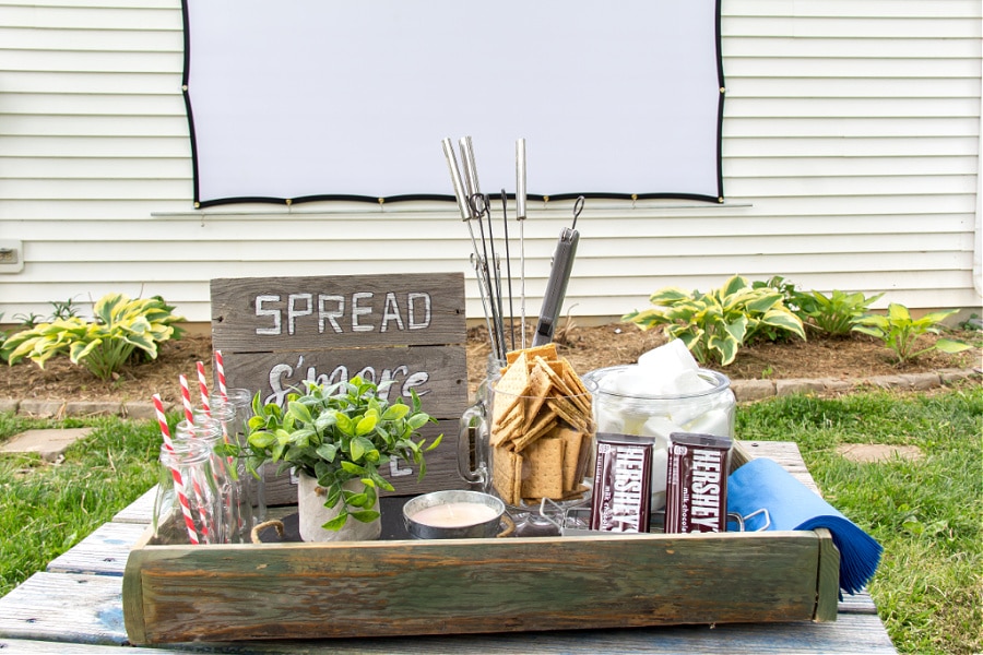 Backyard entertaining ideas including a s'mores bar for an outdoor movie night.