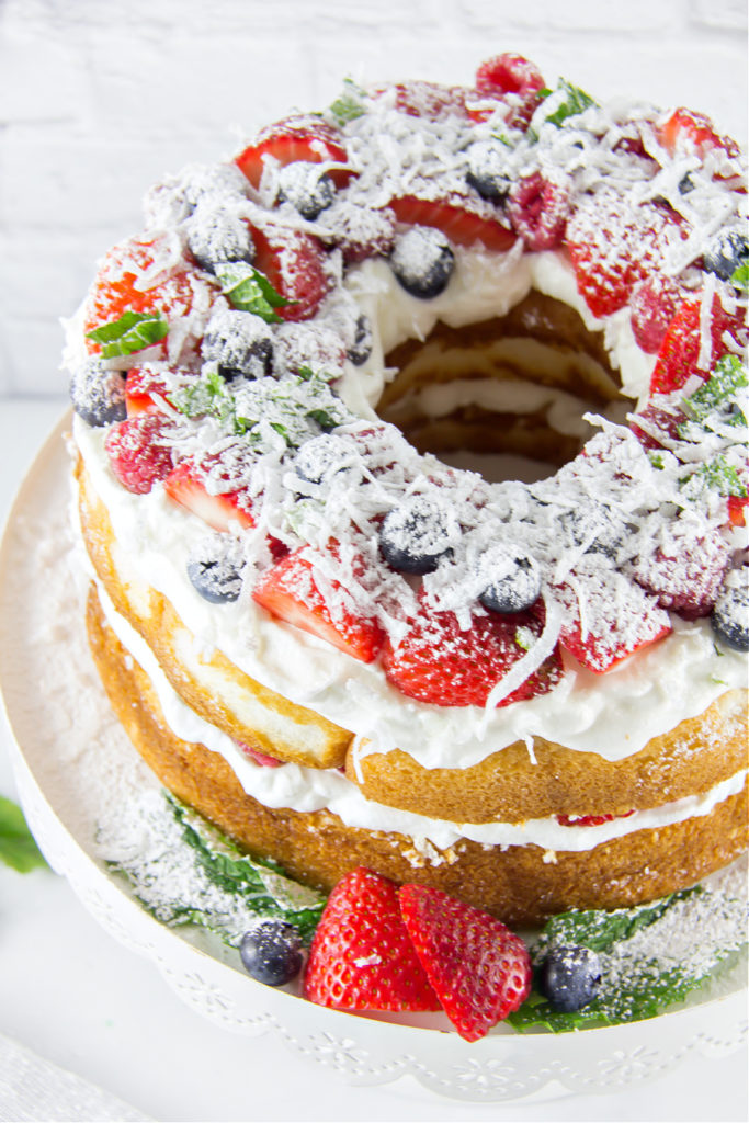 4th of July angel food cake with fresh berries and coconut cream.