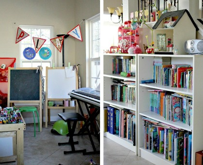 Bookshelves, a whiteboard and chalkboard, along with toys organized in a kids playroom.