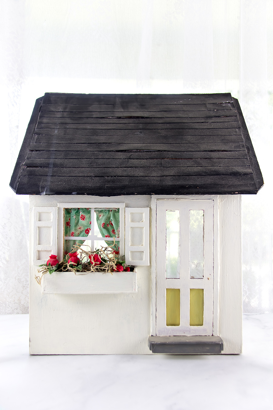 a DIY miniature house that has been decorated