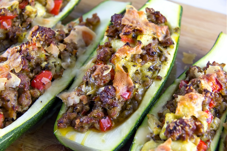 Zucchini boats stuffed with Italian sausage and red peppers.