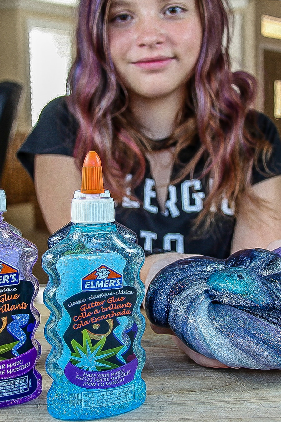 Galaxy slime made with blue and purple Elmer's glitter glue.