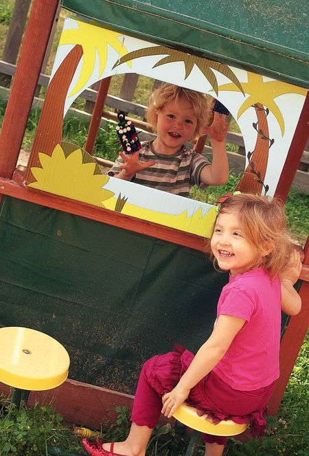 kids putting on a monster puppet show