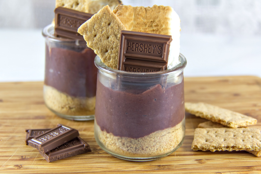 s'mores pudding dessert in a glass jar.