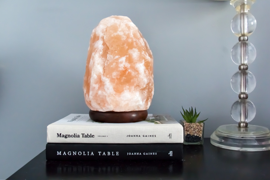 Joanna Gaines Magnolia Table books on a teenage girls bedside table. 