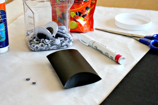 A Halloween bat craft treat box made using toilet paper rolls or pillow boxes.