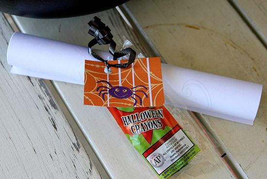 Tie boxes of crayons with coloring pages for non candy Halloween treats