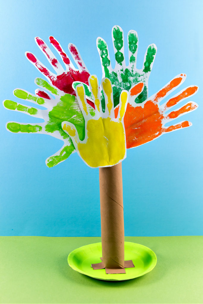 A paper roll thankful tree to make with the whole family using handprints.