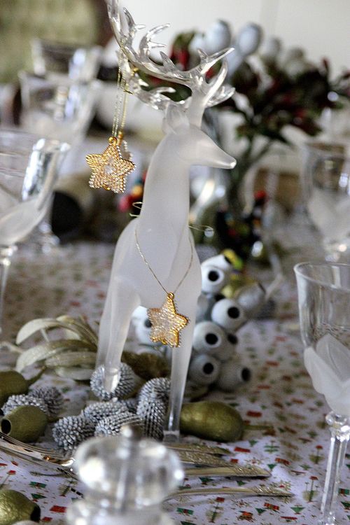 natural Christmas table decorations with a glass reindeer