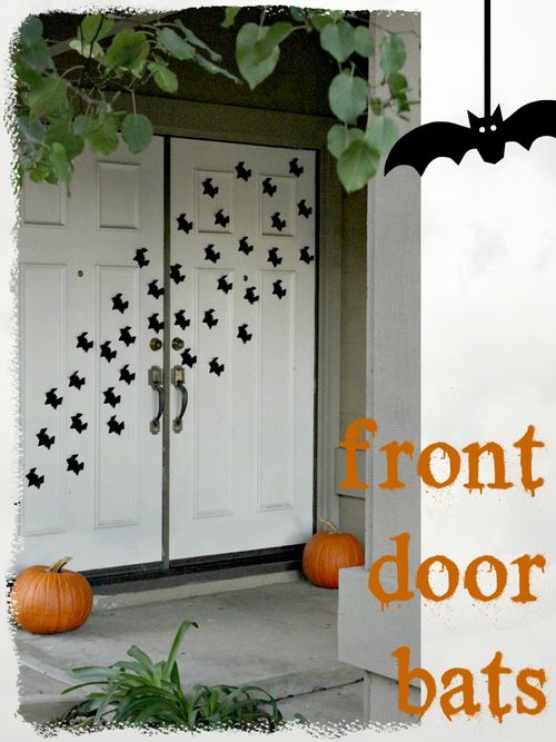 paper bat craft covering the front doors of a house.