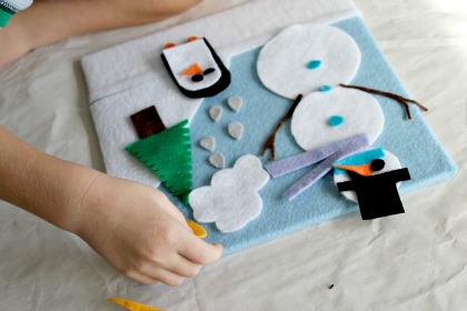 A snowman and penguin winter felt board craft for kids.