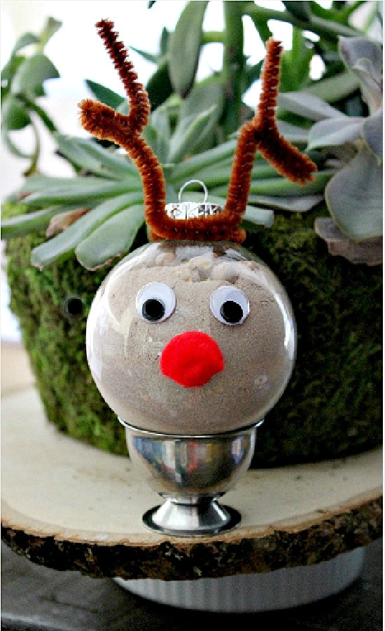 A reindeer Christmas ornament filled with hot chocolate mix.