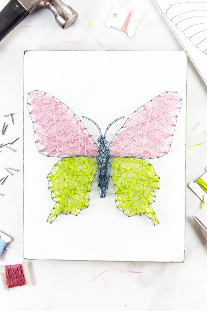 butterfly string art made using a coloring page