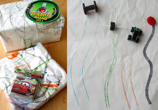 Tire tracks learning activity for kids with toy cars and wheels being rolled over a stamp pad and then onto paper to see the different patterns they make.