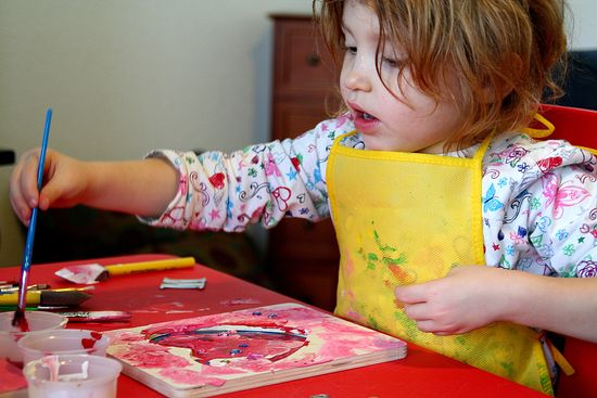 kids painting wood picture frames from Michaels craft store for Valentine's Day. 