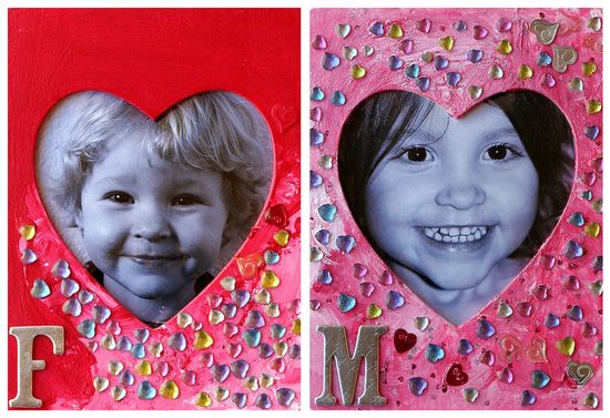 Wood picture frames that have been decorated by kids for Valentine's day.