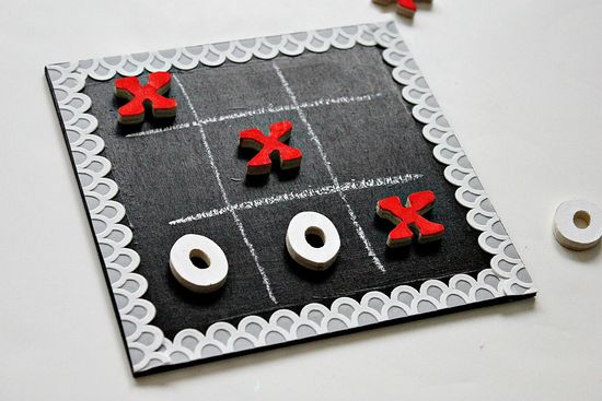 A game board painted with chalkboard paint for playing games like tic tac toe.