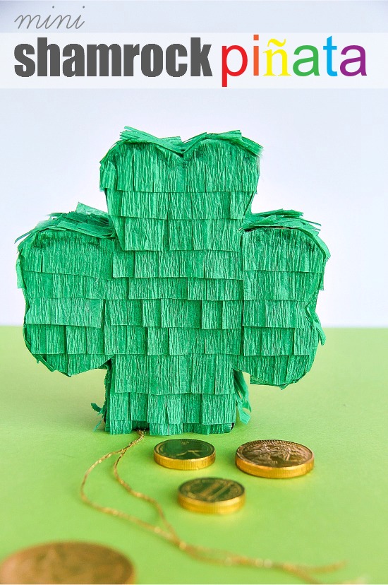 Small green pull-string shamrock pinata craft filled with gold chocolate coins for St. Patrick's Day.