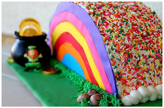 rainbow cake decorated with fondant and sprinkles