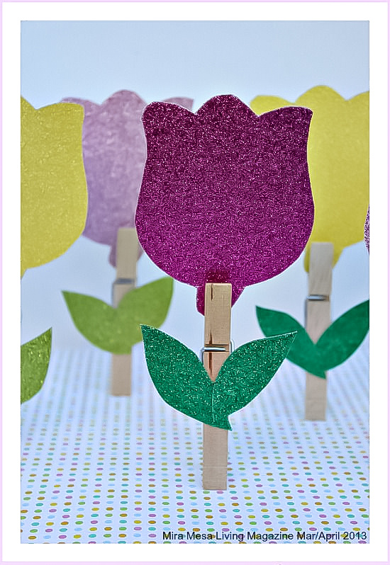 Clothespin flowers made using wooden pegs and glitter card stock.
