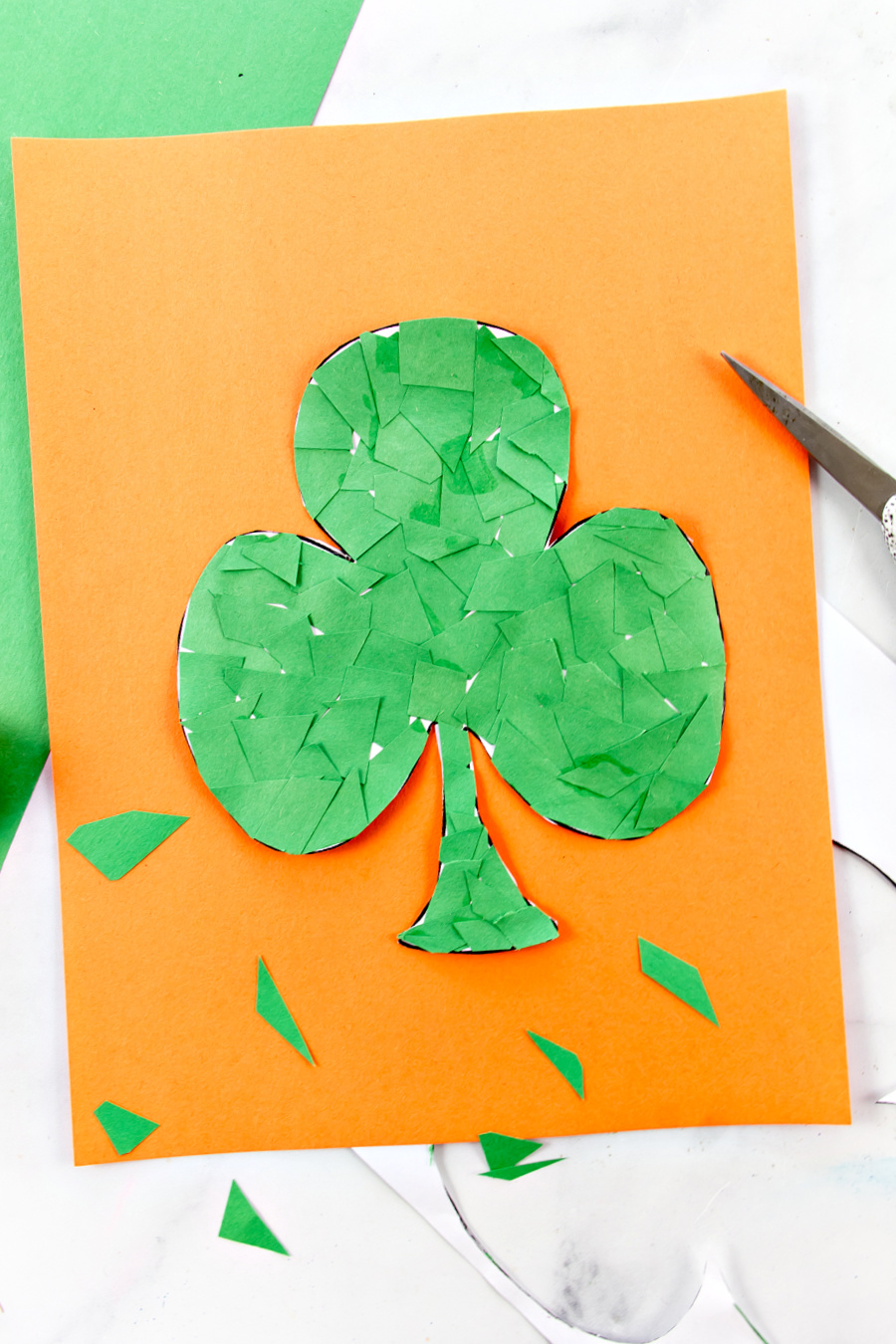 paper cutting mosaic shamrock craft for preschoolers