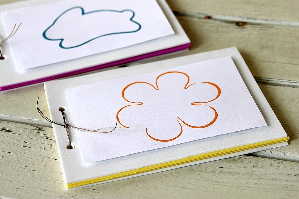 spring memory books that were made out of foam and paper for kids to keep spring break memories in.