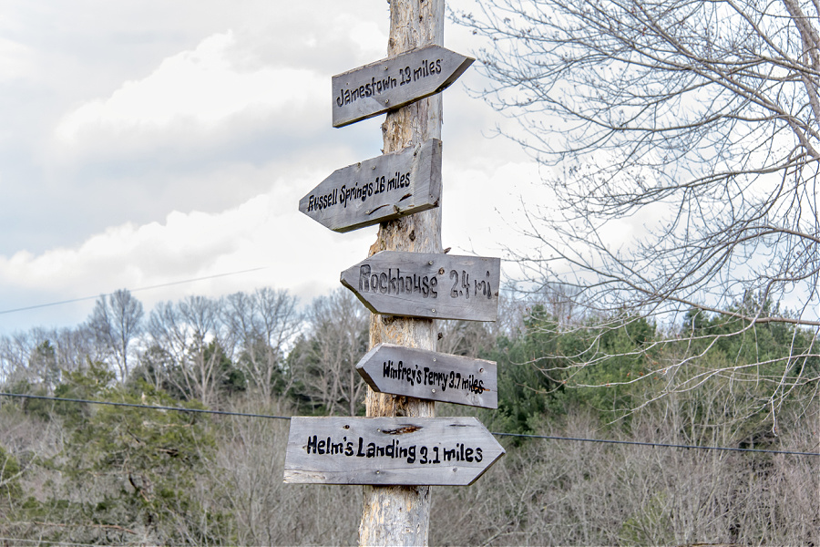 Handmade wood directional sign for locations outside Creelsboro Kentucky