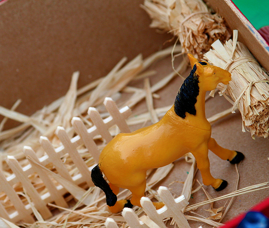 A horse stable craft for kids using a paper mache chest.