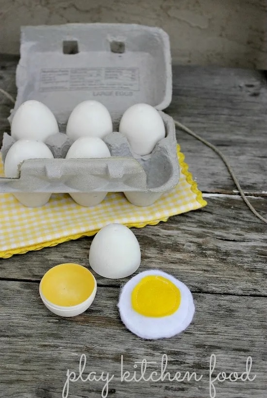 Plastic easter eggs turned into play kitchen eggs in a carton.