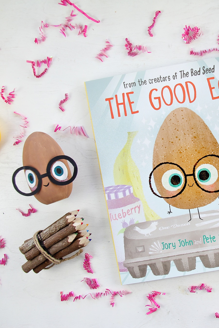 A wood egg decorated with eyes and glasses inspired by The Good Egg book for children.