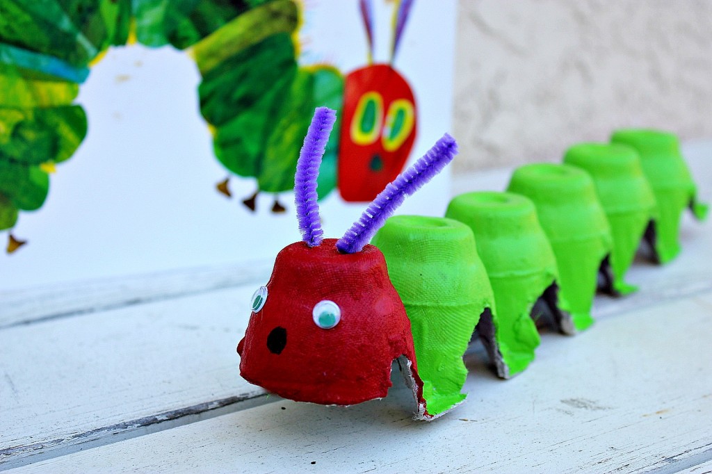 The Very Hungry Caterpillar made using an egg carton, googly eyes, and purple pipe cleaners.