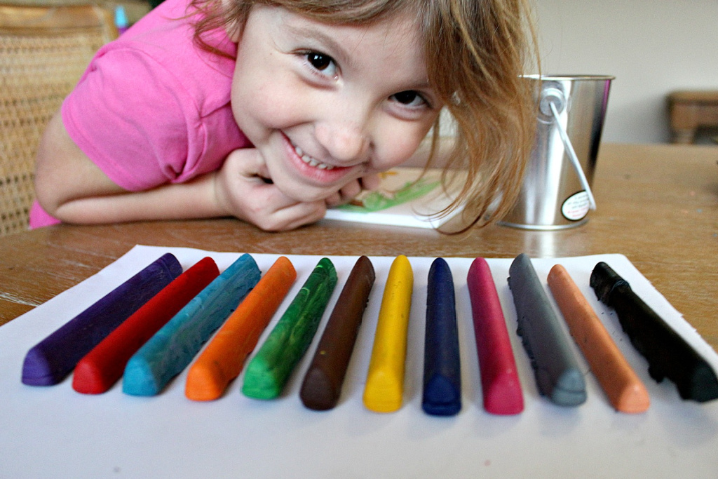 Broken crayons melted in the oven and turned into long crayons for kids using a silicone mold.