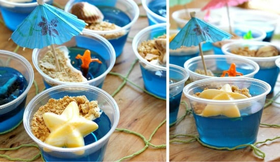 Blue Jell-O cups topped with white chocolate starfish and and cracker sand.